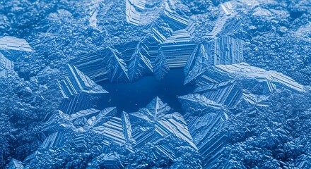 Close up abstract view of intricate blue ice crystal formations with sharp geometric edges and textured surfaces