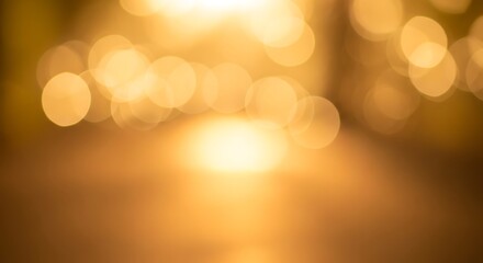 Warm golden bokeh lights creating a soft blurry background with glowing orbs and a bright central glow