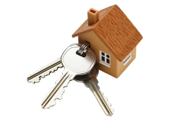 Tiny wooden house model attached to a set of house keys on a transparent background