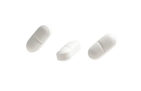 Three white oval shaped pills isolated on a transparent background