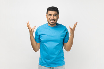 Angry frustrated man standing raised his arms, screaming with aggression, arguing with wife.