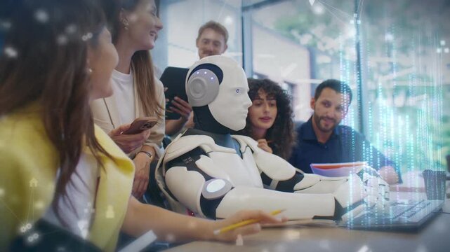 Robot typing rapidly on keyboard while team of coworkers watching in bright office. Group standing around workstation as hologram data streams rising into air during collaborative tech session.