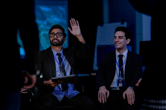 Risk management experts in a strategy meeting discuss AI-powered fraud prevention. This diverse team develops plans to protect customer data and stop financial scammers in fintech. - Powered by Adobe