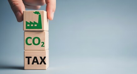 Carbon tax concept with wooden blocks showing industry and co2