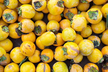 A top shot of a pile of yellow date fruits sold in a Turkish market.