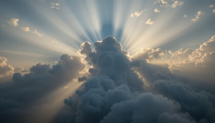 Sun rays shining through dramatic clouds in a blue sky day