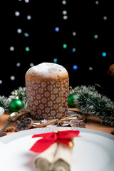 Panettone served on a table with Christmas decorations.