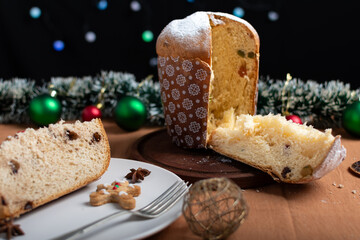 Slice of panettone on a Christmas table.