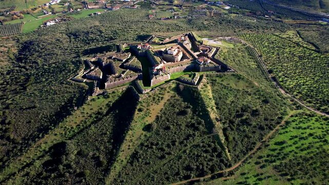 Portugal travel and landmarks, Alentejo region. medieval military fortification Nossa Senhora in Elvas. unique star-shaped  architecture. UNESCO heritage site, aerial drone 4k hd footage