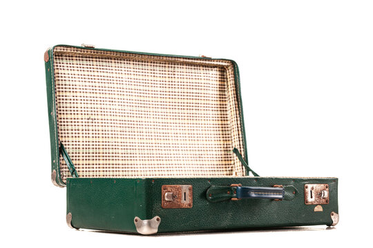 A vintage green suitcase sits open, revealing a classic checked pattern inside. This scene evokes feelings of nostalgia and prepares for a travel adventure - Powered by Adobe