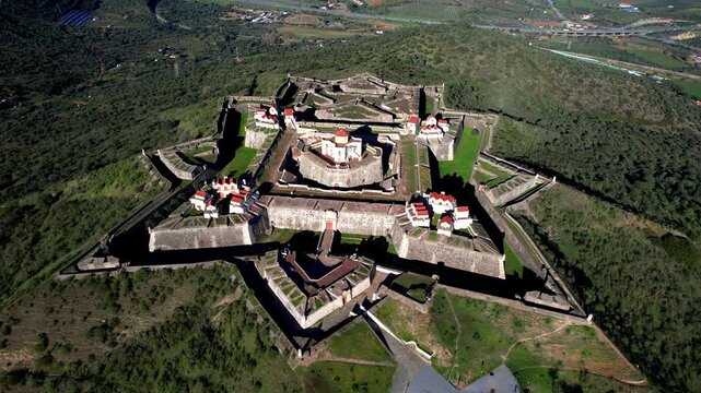 Portugal travel and landmarks, Alentejo region. medieval military fortification Nossa Senhora in Elvas. unique star-shaped  architecture. UNESCO heritage site, aerial drone 4k hd footage