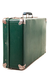 A vintage green suitcase stands upright, featuring a textured surface and reinforced corners. This classic luggage piece evokes memories of past journeys and adventures