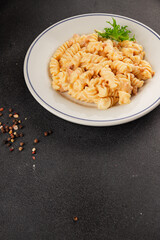 Carbonara pasta fusilli creamy sauce main course Italian cuisine tasty snack fresh delicious gourmet food background on table rustic food top view copy space
