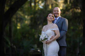 A heartfelt and elegant wedding portrait featuring a beautiful couple (bride and groom) celebrating...