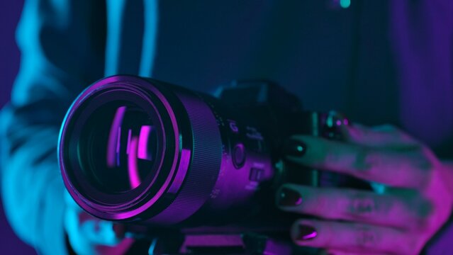 Close up of Camera Lens in Neon Lighting - Powered by Adobe