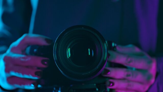 Close up of Camera Lens in Neon Lighting