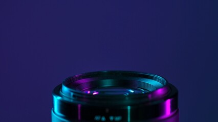 Close-up of Camera Lens with Neon Lighting Effect