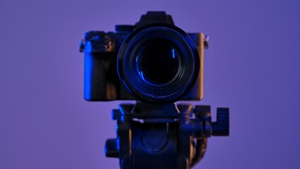 Professional DSLR Camera on Tripod in Blue Light