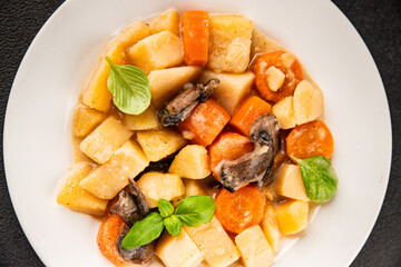 Potato stew mushrooms and vegetables natural tasty snack fresh delicious gourmet food background on the table rustic top view copy space keto and paleo diet vegerian and vegan food