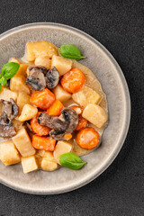 Potato stew mushrooms and vegetables natural tasty snack fresh delicious gourmet food background on the table rustic top view copy space keto and paleo diet vegerian and vegan food
