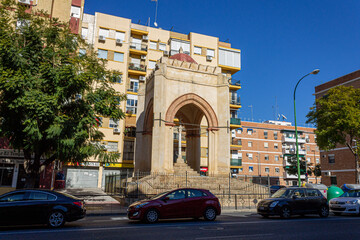 Seville, Spain. View of the 15th century Templete de la Cruz del Campo on Luis Montoto Street, a historic shrine linked to the origins of the city's Via Crucis and later to the Cruzcampo brewery