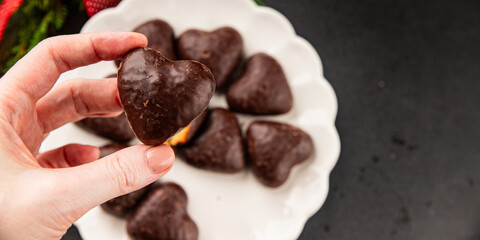 Gingerbread chocolate heart shaped honey cakes Christmas sweet dessert new year natural product tasty snack fresh delicious gourmet food background on the table rustic top view copy space