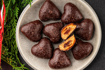 Gingerbread chocolate heart shaped honey cakes Christmas sweet dessert new year natural product tasty snack fresh delicious gourmet food background on the table rustic top view copy space