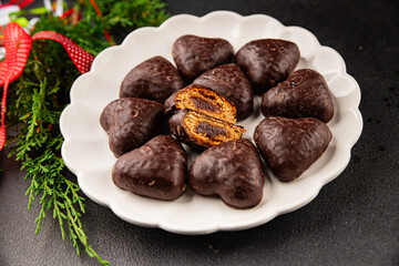 Gingerbread chocolate heart shaped honey cakes Christmas sweet dessert new year natural product tasty snack fresh delicious gourmet food background on the table rustic top view copy space