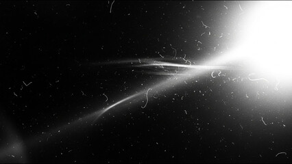 Abstract black and white background with bright light flare and film grain texture overlay, creating a dramatic and vintage cinematic visual effect with dust particles
