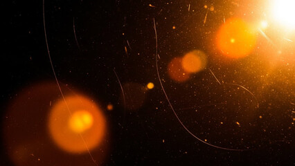 Abstract background with bright orange lens flare and light leak effect, featuring dust particles and subtle film grain scratches on a dark, dramatic backdrop for overlay