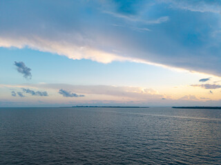 Romantic summer vacation at seascape. Sunset sea and seascape. Sea horizon view. Cloudy sky and seascape at summer vacation. Skyscape with sea horizon. Calm horizon with sea nature. Beach paradise