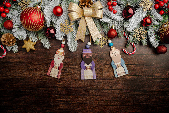 Happy Three King's Day, of January 6. The three wise men over wooden background. Concept for Dia de Reyes Magos day. Three Wise Men flat lay with Christmas decorations