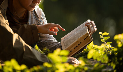 Reading the Bible and praying together outdoors
