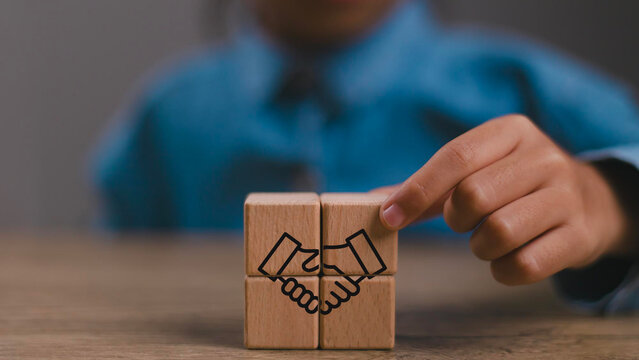 Empathy in leadership concept. Wooden block symbolizing trust, empathy and partnership representing individuals, emotional intelligence and trust in workplace leadership and team collaboration.