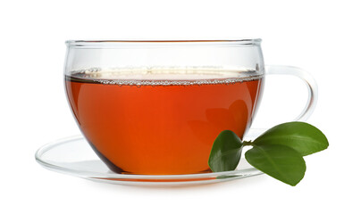 Cup of hot tea and green leaves isolated on white