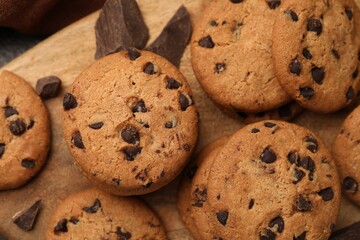 Delicious chocolate chip cookies on table, top view