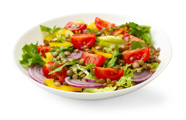 Delicious salad with lentils and vegetables isolated on white