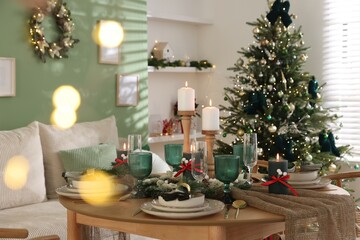 Festive table setting with Christmas decor indoors