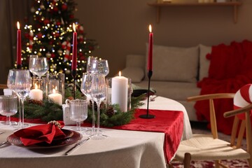Festive table setting with Christmas decor indoors