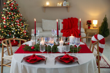Festive table setting with Christmas decor indoors