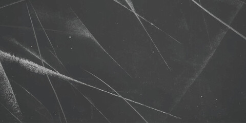 Abstract white chalk lines on a dark gray textured surface, artistic scratches