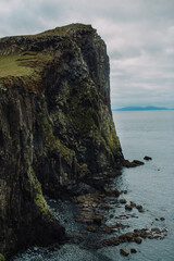 Dramatic Basalt Rock Formations at Neist Point Lighthouse, Isle of Skye, Scotland: Rugged Coastal Landscape at Sunset.