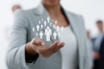 Businesswoman holding virtual figures of people in a network concept