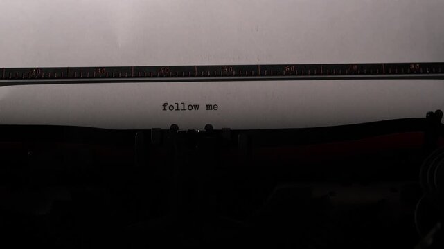 Vintage typewriter typing follow me text message on white paper sheet, representing social media engagement, invitation, communication, and networking concepts