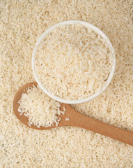 Grated coconut powder. Dry coco flakes pile, shredded desiccated coconut, tropical fruit chips