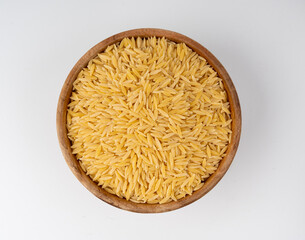 Raw orzo pasta, risoni or kritharaki pile
