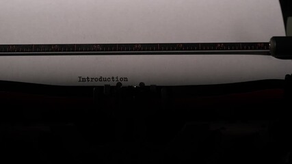 Vintage typewriter creating the word introduction on a sheet of white paper, symbolizing new beginnings, content creation, and an opening for stories, documents, or presentations