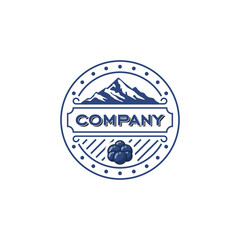 Classic blue emblem logo featuring a mountain peak and fresh berries for a brand identity