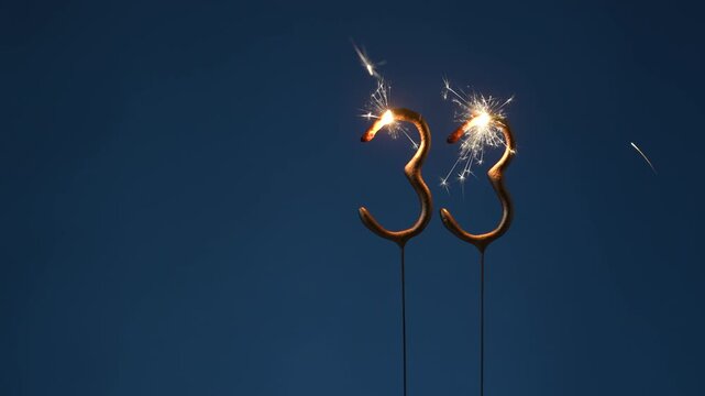 33 years celebration festive background made with Bengal fires in the form of number Thirty three.