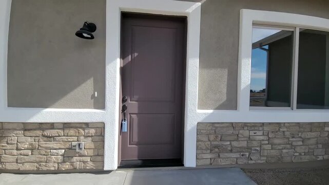 Captivating Front Entrance With Illuminated Shadows Highlighting Stone And Painted Wooden Elements